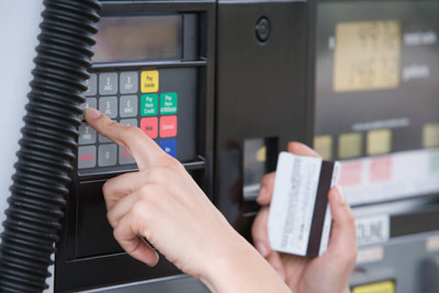 Fleet drivers managing vehicle fuel purchases with WEX card reporting and account controls